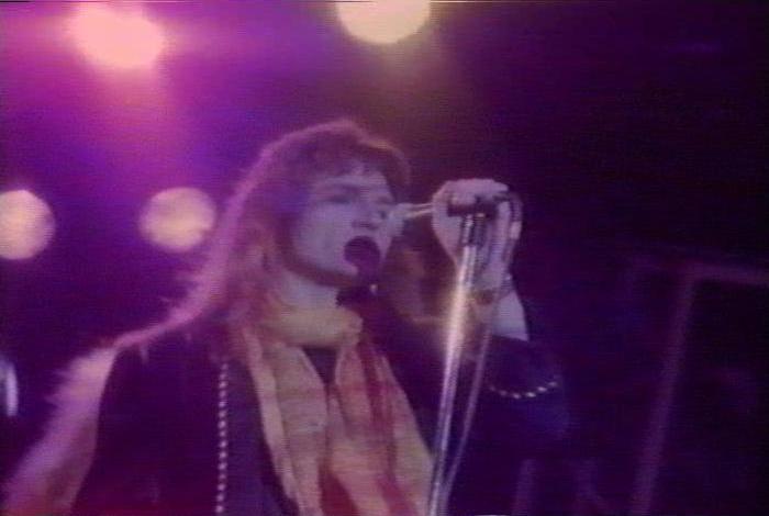 Screenshot from the music video for 'Heaven Is A 4-Letter Word'