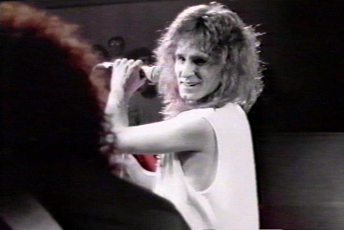 Screenshot from the music video for 'Heaven Is A 4-Letter Word'