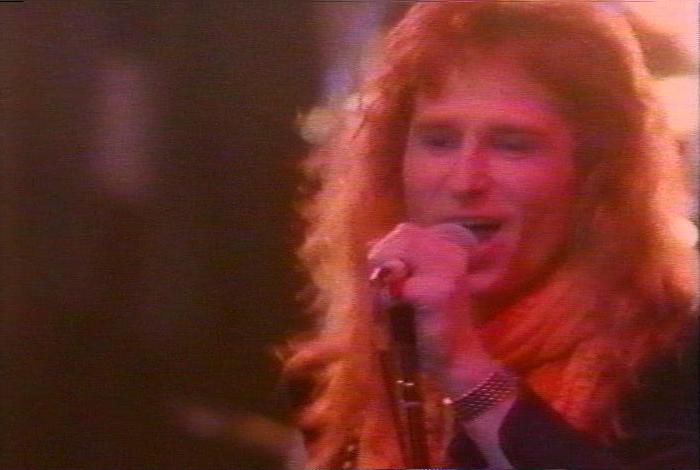 Screenshot from the music video for 'Heaven Is A 4-Letter Word'